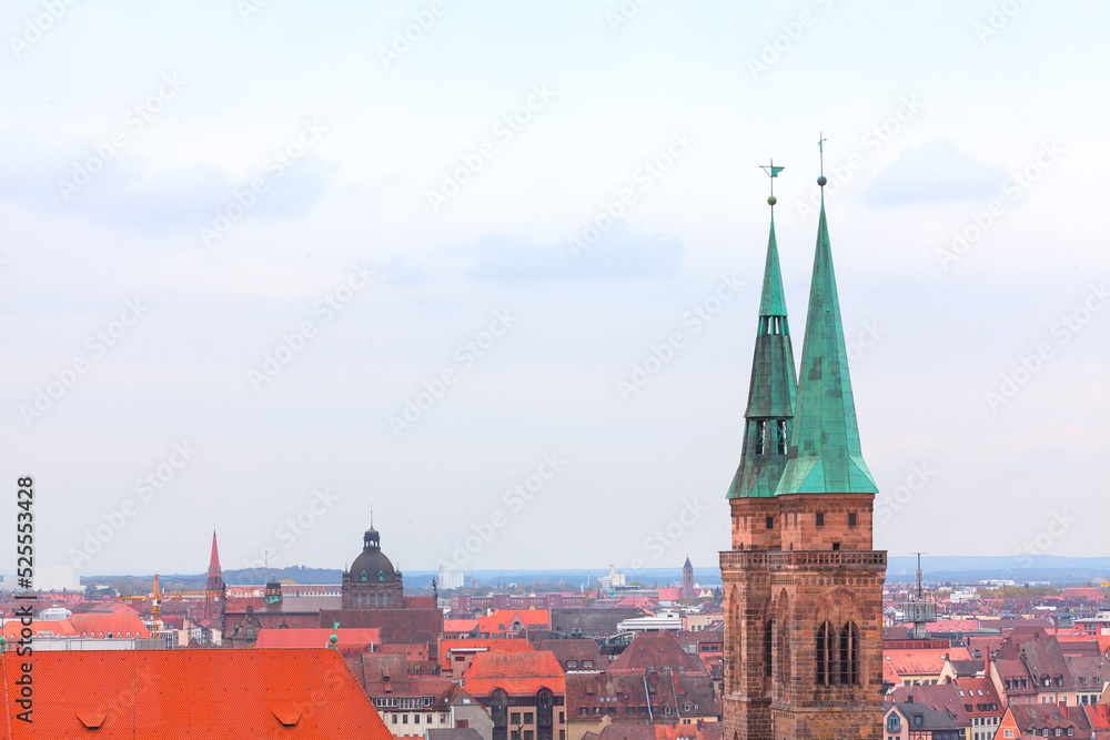 Old town rooftops scenery . Nuremberg view from above . Sebalduskirche Lutheran Church in Bavaria Germany 