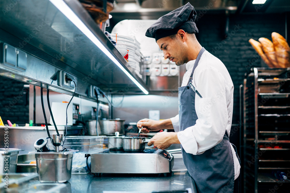 Man cooking in contemporary kitchen Man cooking in contemporary kitchen