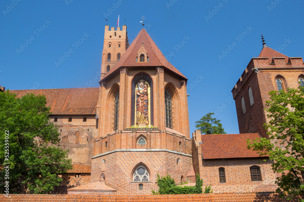 Maria sculpture on the church of the castle in Malbork, Poland