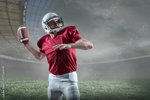 American football sportsman player with ball in action on stadium