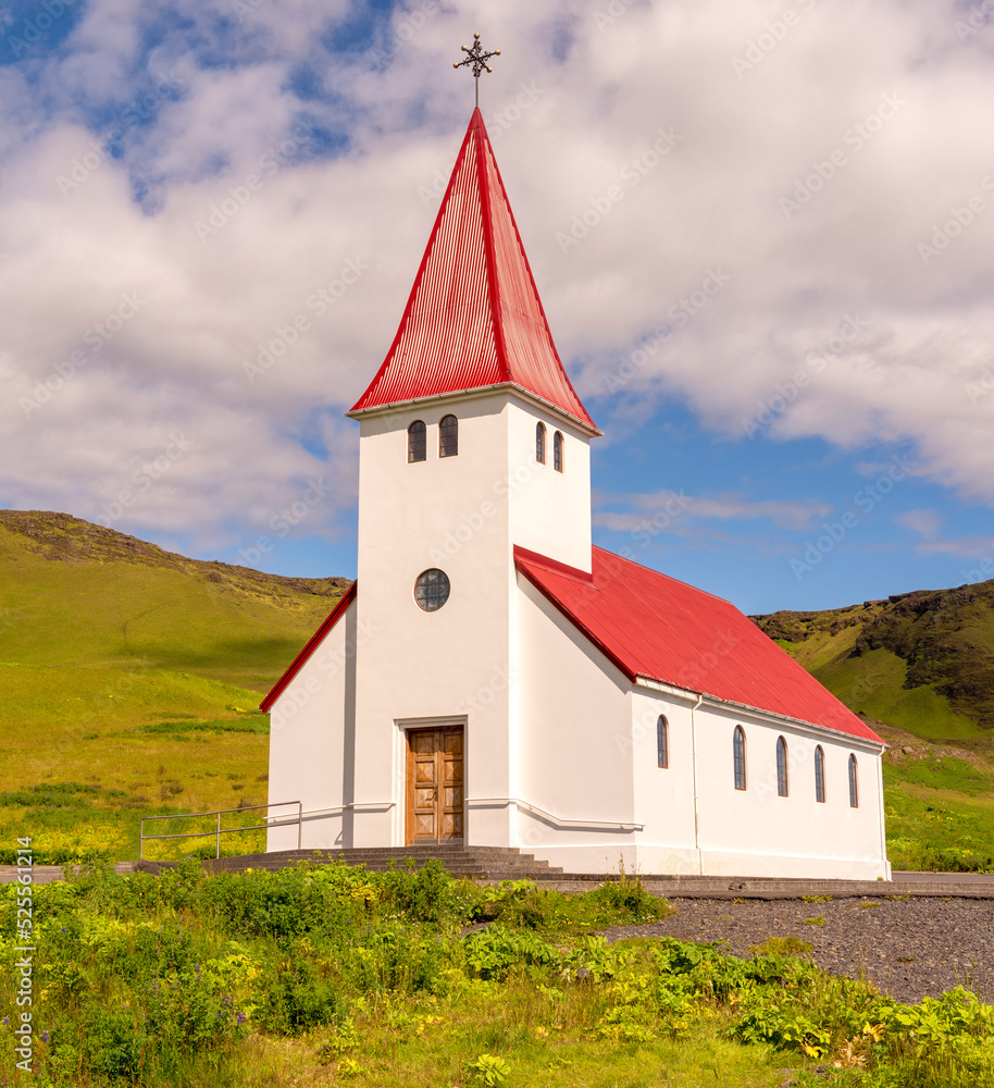 Fototapeta premium On a hill above Vik is this small church, Iceland