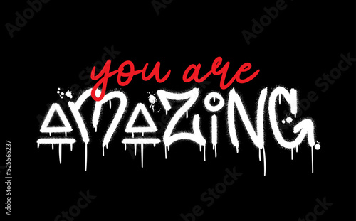 Slogan of you are amazing with splash effect and drops. Urban street graffiti style. Print for graphic tee, sweatshirt, poster. Vector illustration is on black background