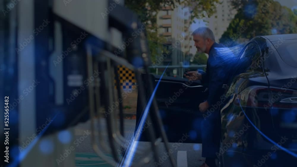 Animation of blue light trails over caucasian senior businessman getting out of his car Animation of blue light trails over caucasian senior businessman getting out of his car