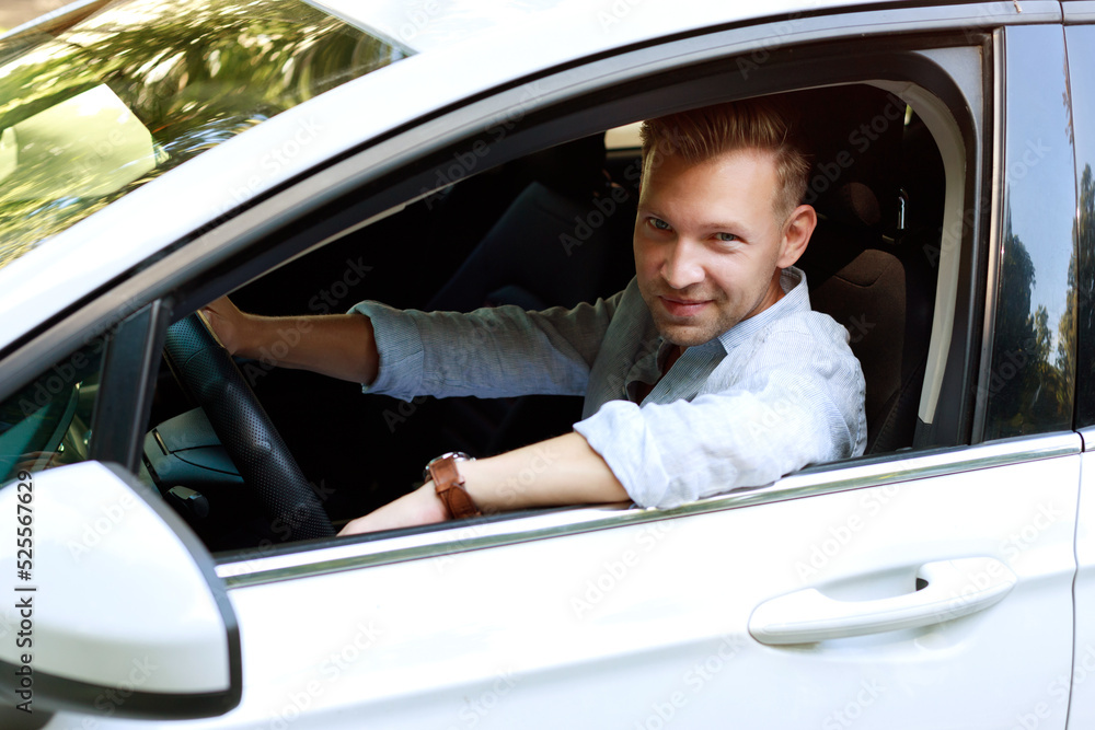 attractive man driving a car. rent a car, buy a car attractive man driving a car. rent a car, buy a car