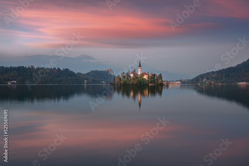 Stunning sunset view of popular tourist destination Bled lake.