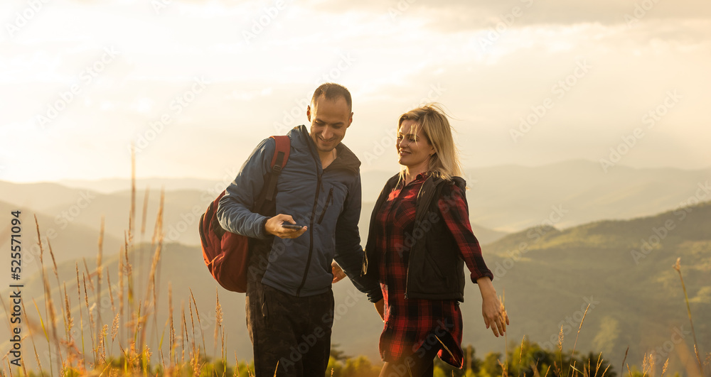 beautiful young couple enjoying nature at mountain