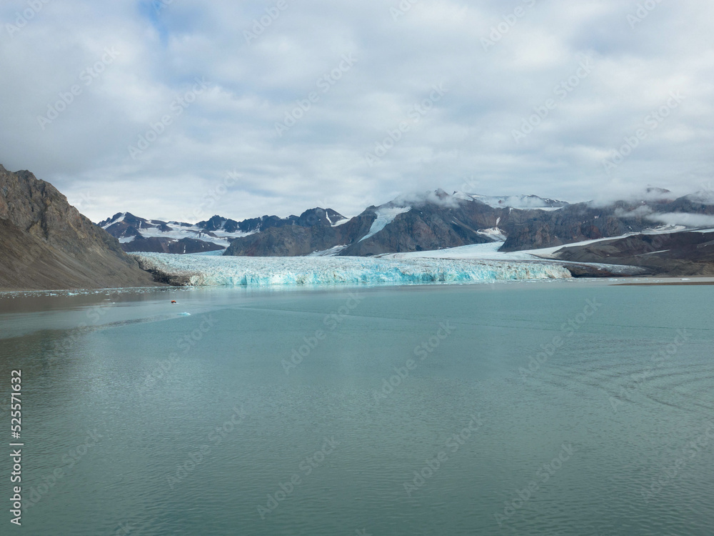 Naklejka premium Panorama view of the 14th of July Glacier or the Fjortende Julibreen. Is a beautiful glacier found in northwestern Spitsbergen. Floating Pack Ice in the arctic ocean. Svalbard, Norway