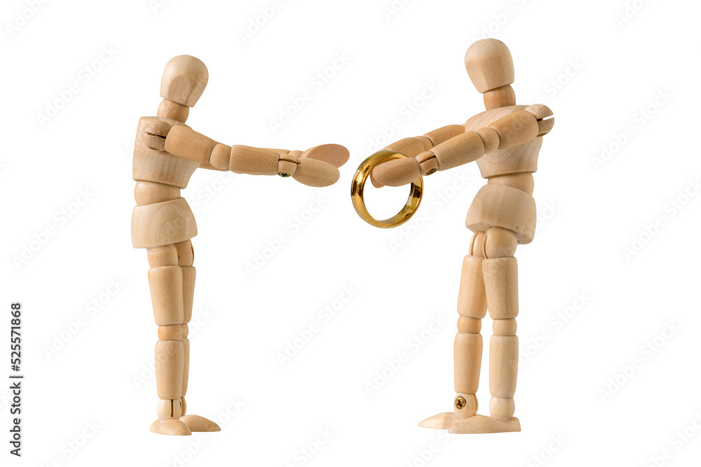 Wooden man making proposal with engagement ring