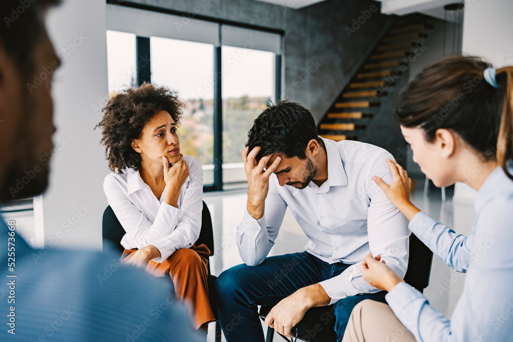 A man with addiction talking about problems on support group. A man with addiction talking about problems on support group.