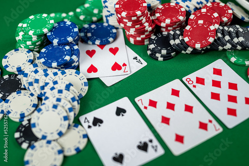 Poker cards with three of a kind or set combination.