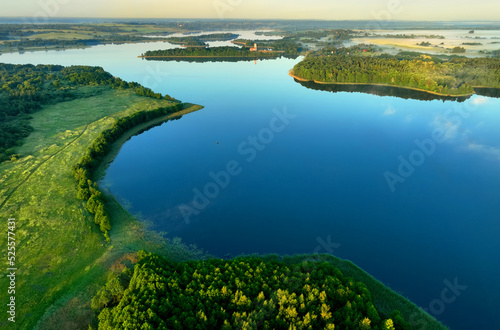 Lake on sunset, drone view. Rural landscape with lakes. Sunset over the forest lake. Drink water safe. Global drought crisis. Pond in countryside with fields and forest. Forest Lake at sunset. Nature.