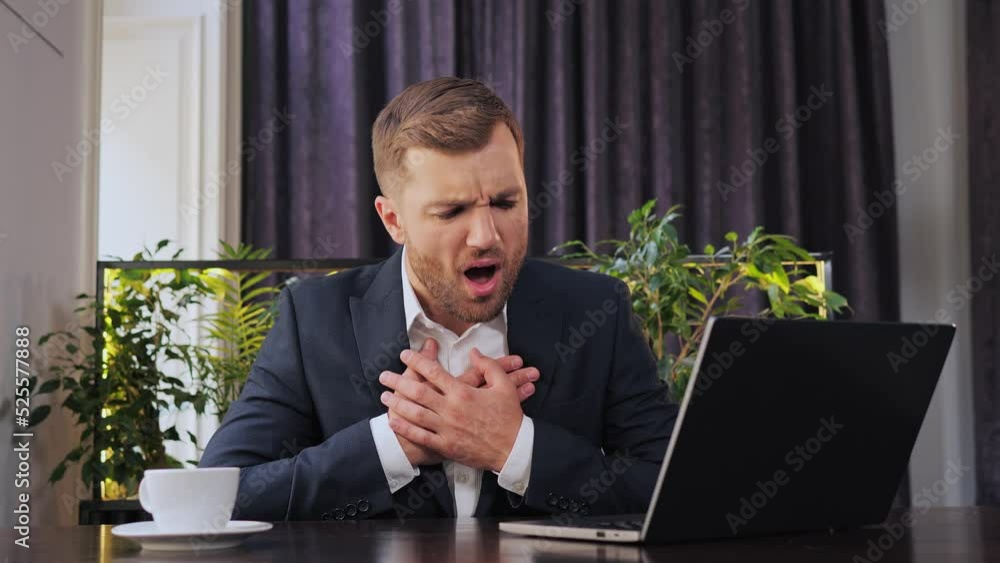 Stockvideon Trouble breathing, chest pain. Businessman sitting in