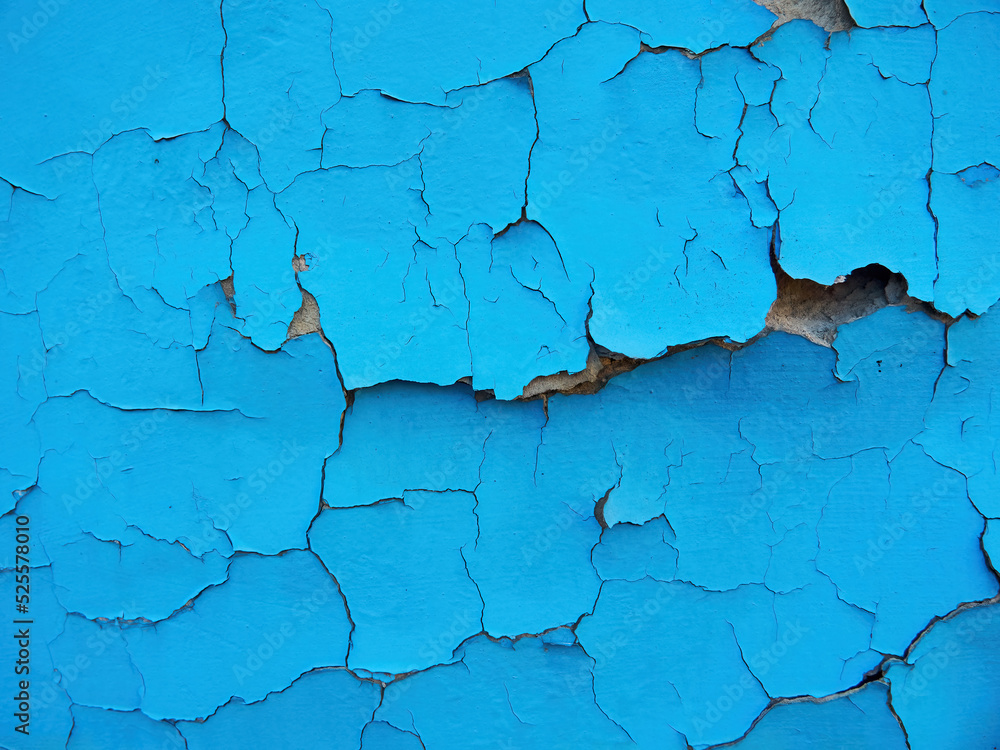 Old cracked wall background, dirty grunge texture. Paint peeling plaster walls. the cement walls are broken blue paint