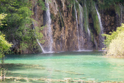 Beautiful paradise. Blue lake and waterfall in the forest  Plitvice lakes  Croatia.