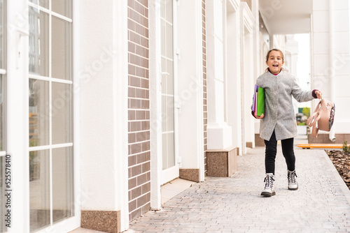 Beautiful little schoolgirl with a backpack © Angelov