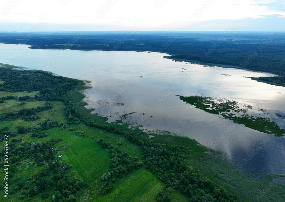 Lake on sunset, drone view. Rural landscape with lakes. Sunset over the forest lake. Drink water safe. Global drought crisis. Pond in countryside with fields and forest. Forest Lake at sunset. Nature. Lake on sunset, drone view. Rural landscape with lakes. Sunset over the forest lake. Drink water safe. Global drought crisis. Pond in countryside with fields and forest. Forest Lake at sunset. Nature.