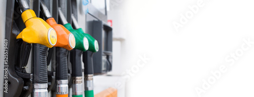 gas pump nozzles at gas station with copy space banner format
 photo
