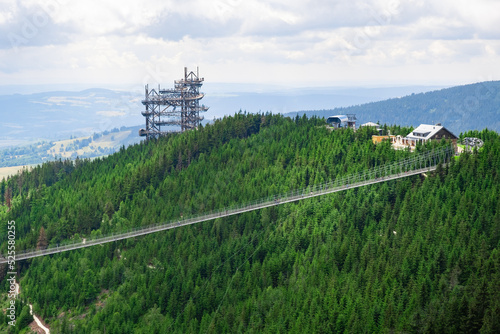 Sky walk observation tower in the forest between mountain hills near Sky Bridge 721 in a sunny summer day, Dolni Morava, Czech Republic.  photo