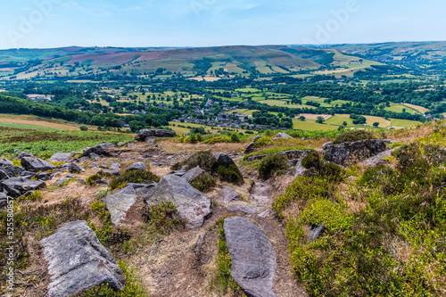 A view of Bamford and rock outcrops on the top of the Bamford Edge escarpment in summertime