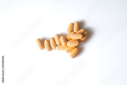 Image of orange pills isolated with shadows