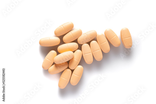 Image of orange pills isolated with shadows