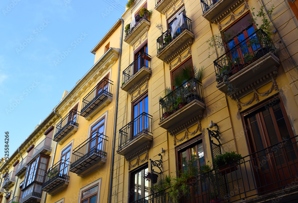 Facade of a building. Residential building with balconies and windows. Colorful buildings apartments. House with window and balcony. Buildings architecture in Europe..