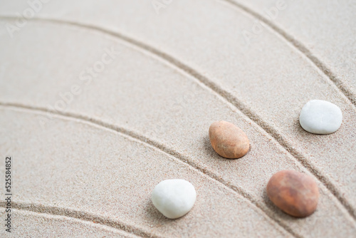 Japanese Zen Garden with Pebble with Line on Sand.mini Stone on Beach backgrond Top View and nobody.Ciircle Rock Balance Japan on nature.Simplicity Purity life.Relax Aromatherapy Spa and Yoga.Buddhism photo