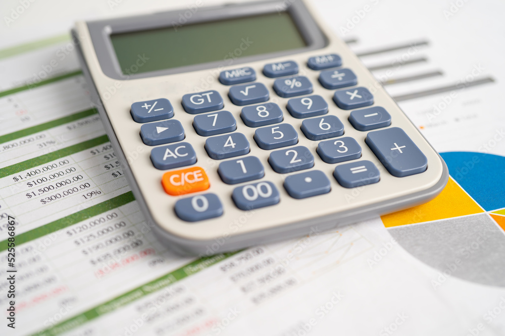 Calculator on graph paper. Finance development, Banking Account, Statistics, Investment Analytic research data economy, Stock exchange trading, Business company concept. Calculator on graph paper. Finance development, Banking Account, Statistics, Investment Analytic research data economy, Stock exchange trading, Business company concept.