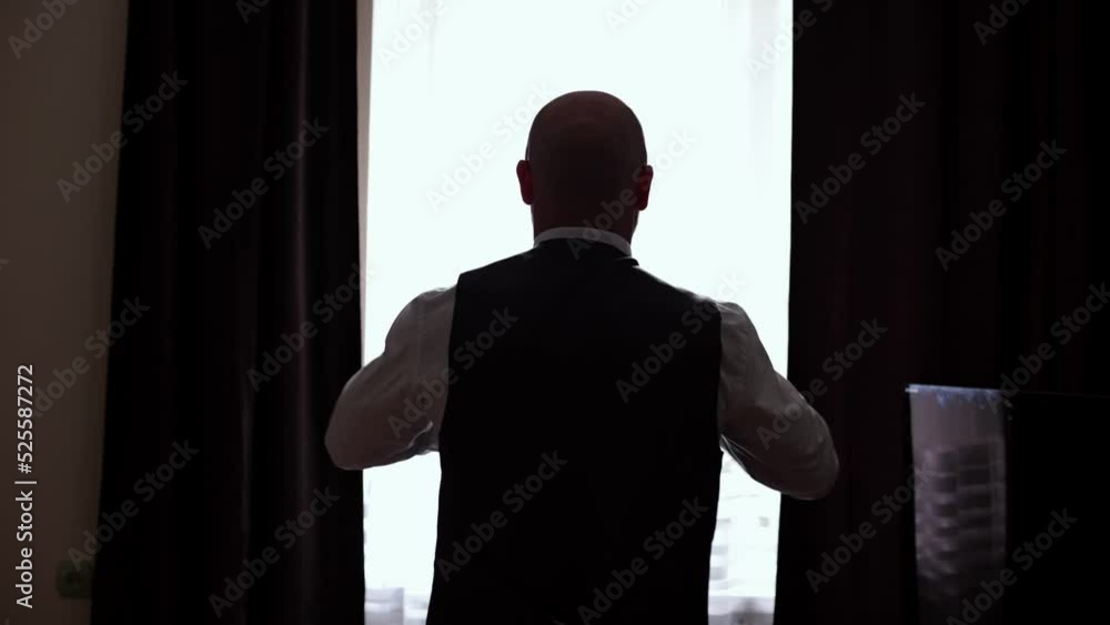 Man hesitates against the background of the window, silhouette. Man hesitates against the background of the window, silhouette.