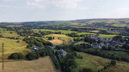 Aerial view of farmland and countryside with trees and fields. Taken in Lancashire England. 