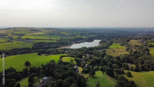 Aerial view of farmland and countryside with trees and fields. Taken in Lancashire England. 
