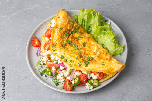 Homemade stuffed omelet on ...