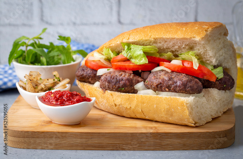 Delicious Turkish Meatballs Sandwich, Kofte Ekmek. Turkish name; kofte ekmek or ekmek arasi kofte photo