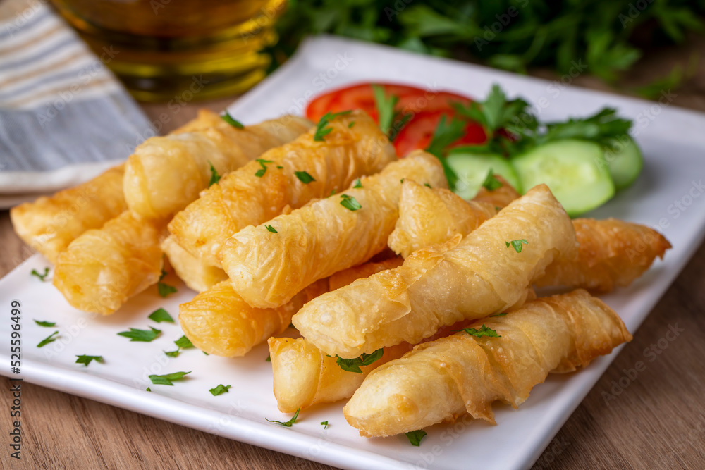 Fried pastry wrapped in cheese in phyllo. Pie in the form of a roll. Turkish name; Kalem borek - sigara boregi Fried pastry wrapped in cheese in phyllo. Pie in the form of a roll. Turkish name; Kalem borek - sigara boregi