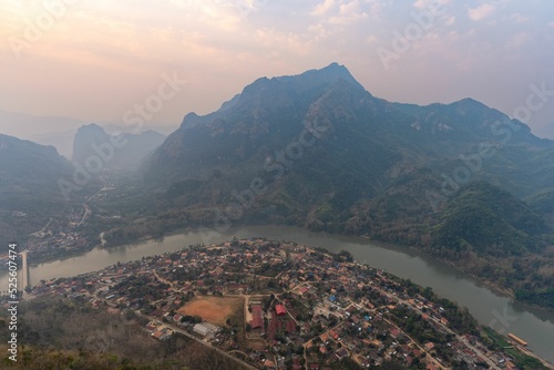 Aerial view of Nong Khiaw village seen from Phadeng Peak at sunset in Laos