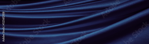 Black blue silk satin. Dark elegant background with space. Wavy folds. Shiny fabric. Luxurious. Valentine, 14.02, Christmas, New year, festive. Banner. Long. Wide. Panoramic. Website header. Design.