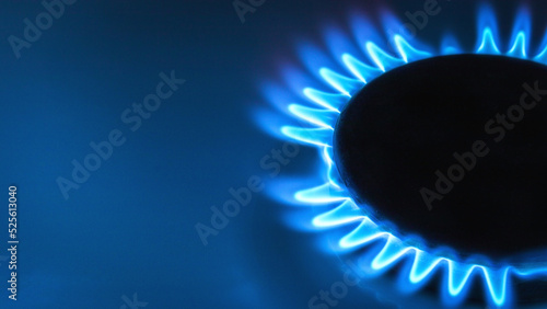 blue natural gas flame with space for text on blue background close up photo