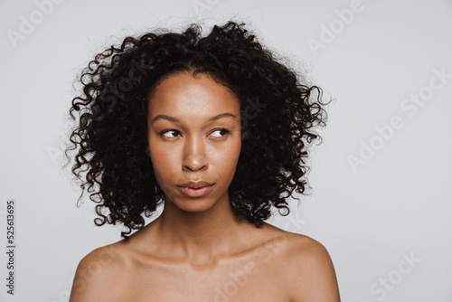 Shirtless black woman posing and looking aside