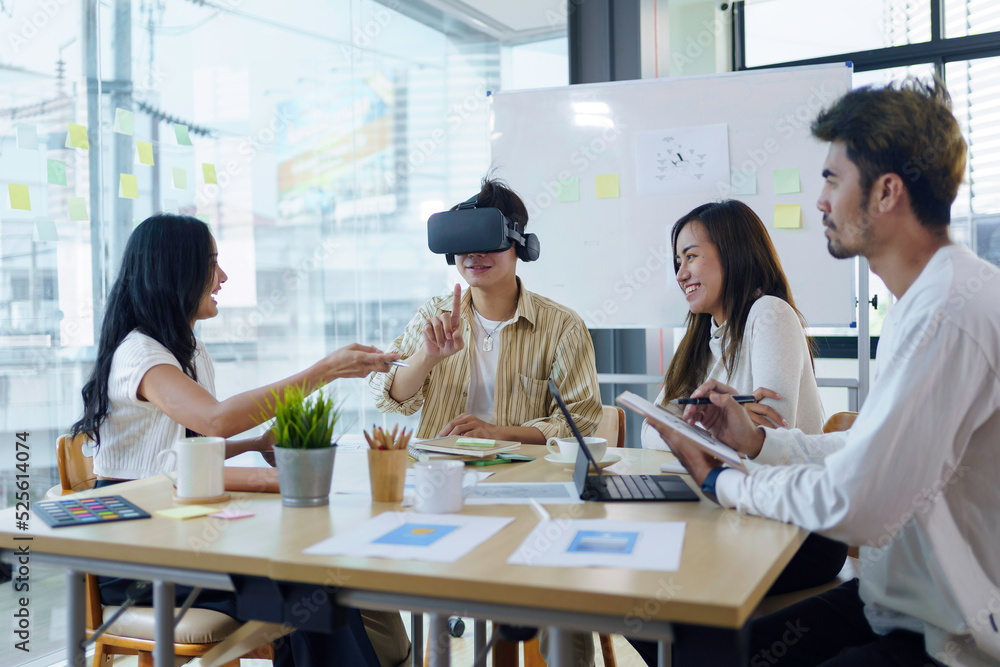 Group of young entrepreneur in Asia used virtual reality glasses during the conference to test the performance of virtual reality headsets and exchange ideas share new knowledge approaches. Group of young entrepreneur in Asia used virtual reality glasses during the conference to test the performance of virtual reality headsets and exchange ideas share new knowledge approaches.