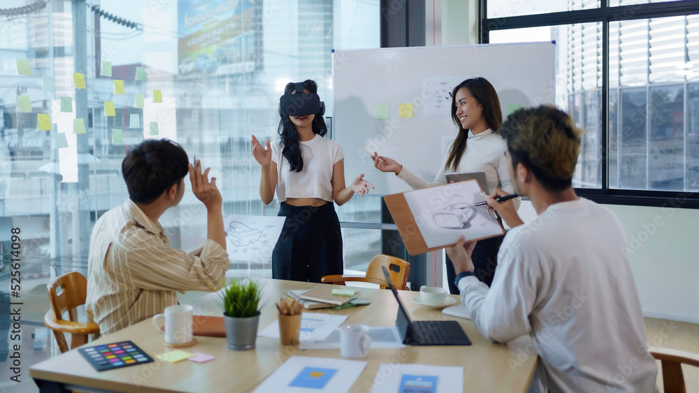 Group of young entrepreneur in Asia used virtual reality glasses during the conference to test the performance of virtual reality headsets and exchange ideas share new knowledge approaches.