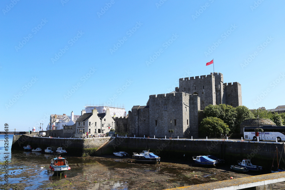 Fototapeta premium A view of Rushen Castle from across the harbour in Castletown on the southern coast of the Isle of Man.
