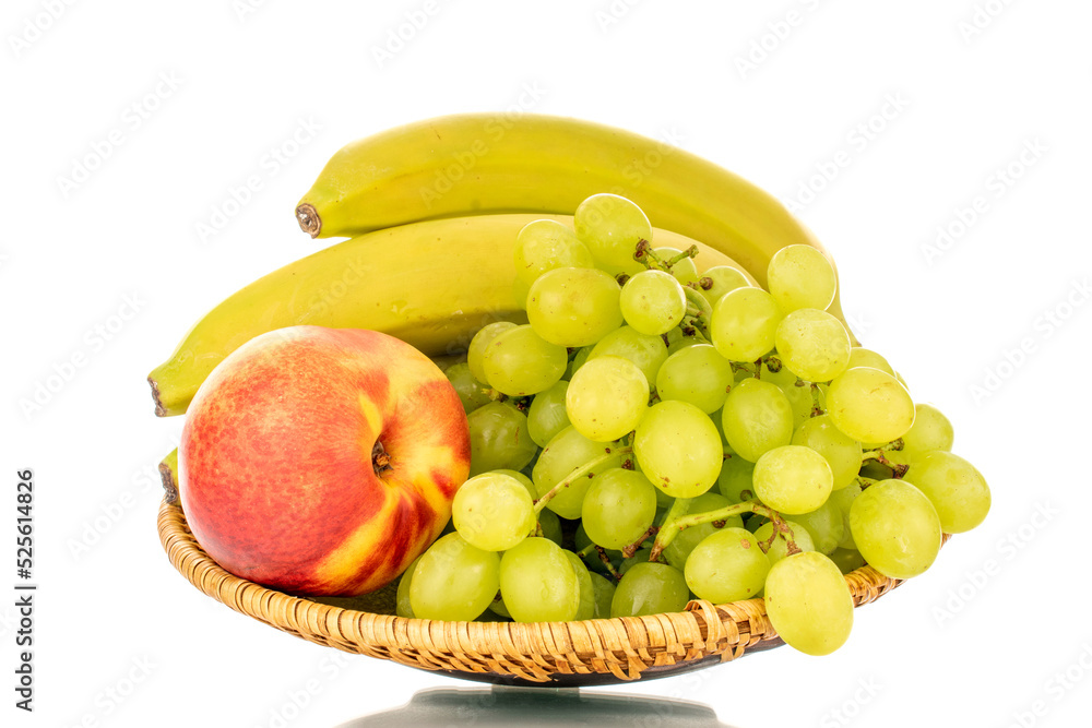 One bunch of white grapes Quiche mish, bananas and nectarine on a ceramic plate, close-up, isolated on a white background. One bunch of white grapes Quiche mish, bananas and nectarine on a ceramic plate, close-up, isolated on a white background.