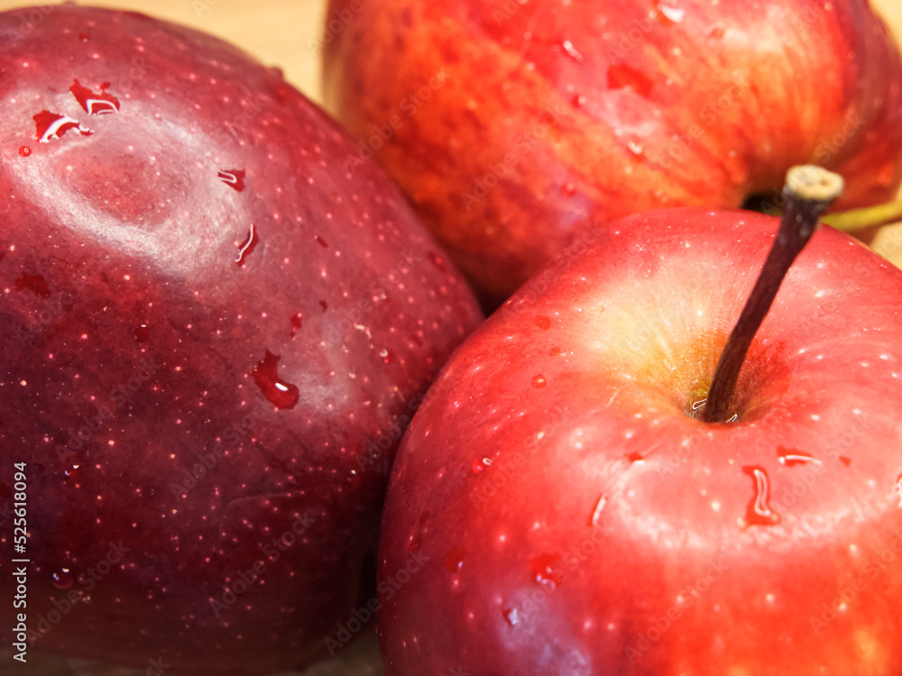Three big red apples, closeup shot. Appetizing ripe fruits, macro. Three big red apples, closeup shot. Appetizing ripe fruits, macro.
