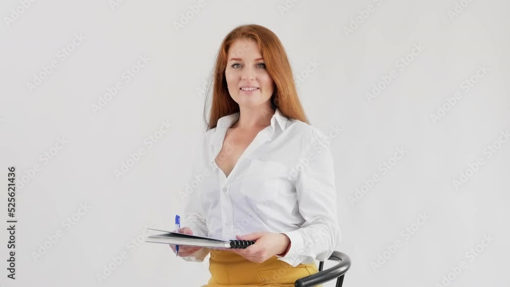 Portrait of successful businesswoman at white background. Young confident woman with document folder. Concept of management, planning. 4K, UHD Portrait of successful businesswoman at white background. Young confident woman with document folder. Concept of management, planning. 4K, UHD