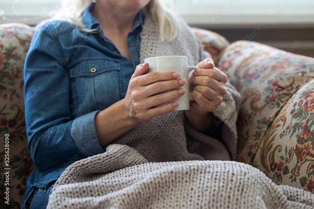 warm cup of hot coffee warming in the hands of a girl. warm cup of hot coffee warming in the hands of a girl.