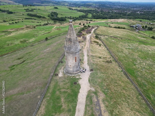 Aerial shot of the Hartshaed Pike Tower in Tameside, Greater Manchester, England photo