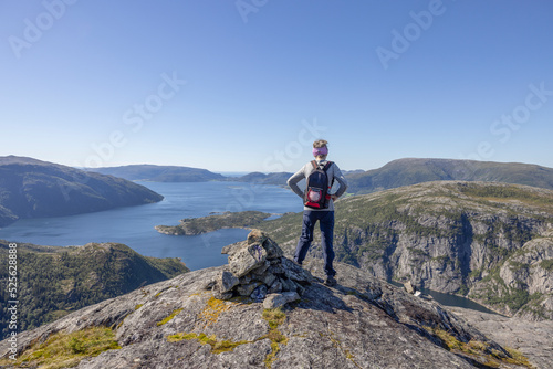 Woman on Mountain trip to Gravtind on a beautiful sunny day, Hongset, Velfjord,Helgeland,Nordland ,Norway,scandinavia,Europe photo