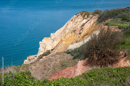 Face side profile in the colored rocks of Alum bay, Isle of Wight photo