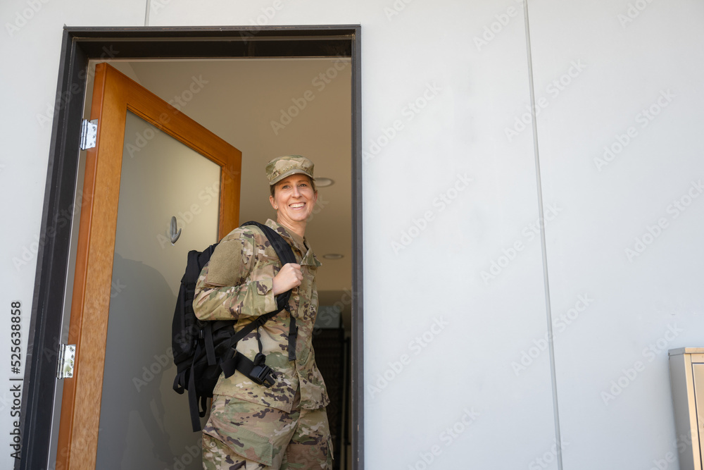 Air Force service member gets ready for work and leaves.