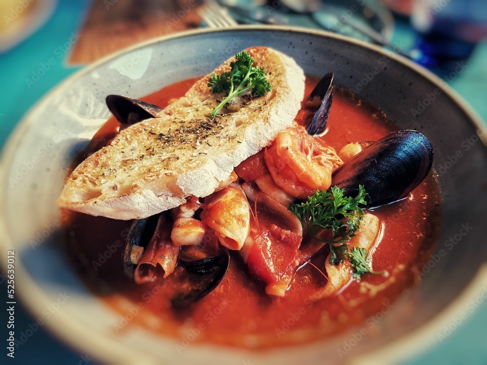 Fototapeta premium Selective focus shot of Seafood soup in a bowl in Cape Town, South Africa